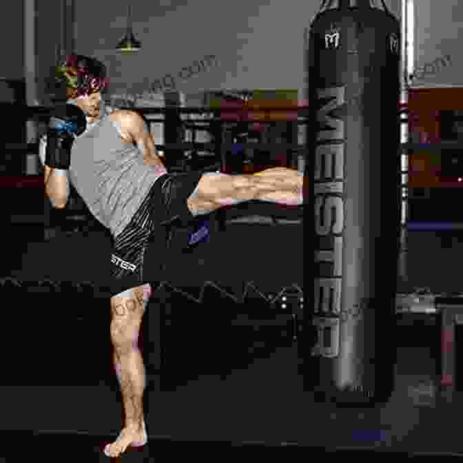 A Muay Thai Fighter Kicking A Heavy Bag. Meditations On Violence: A Comparison Of Martial Arts Training Real World Violence