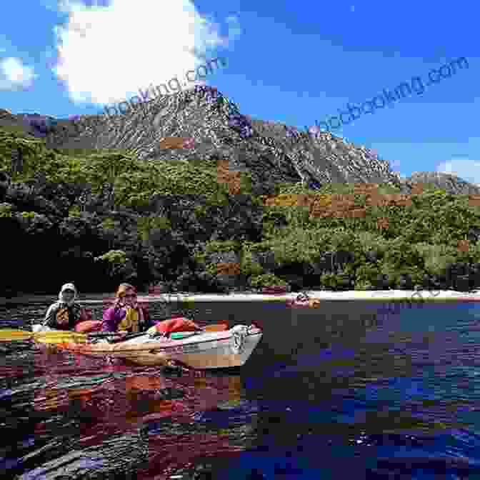 Kayakers Exploring A Secluded Cove In Tasmania Undiscovered Tasmania: A Locals Guide To Finding Adventure